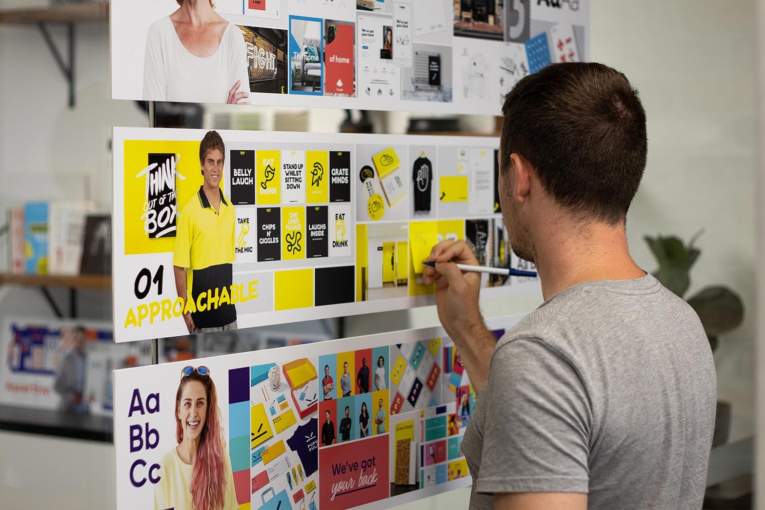 Embark Agency team member looking at example brand positioning mood boards