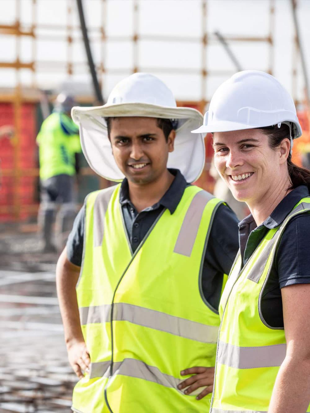 Alder construction site photo with two team members