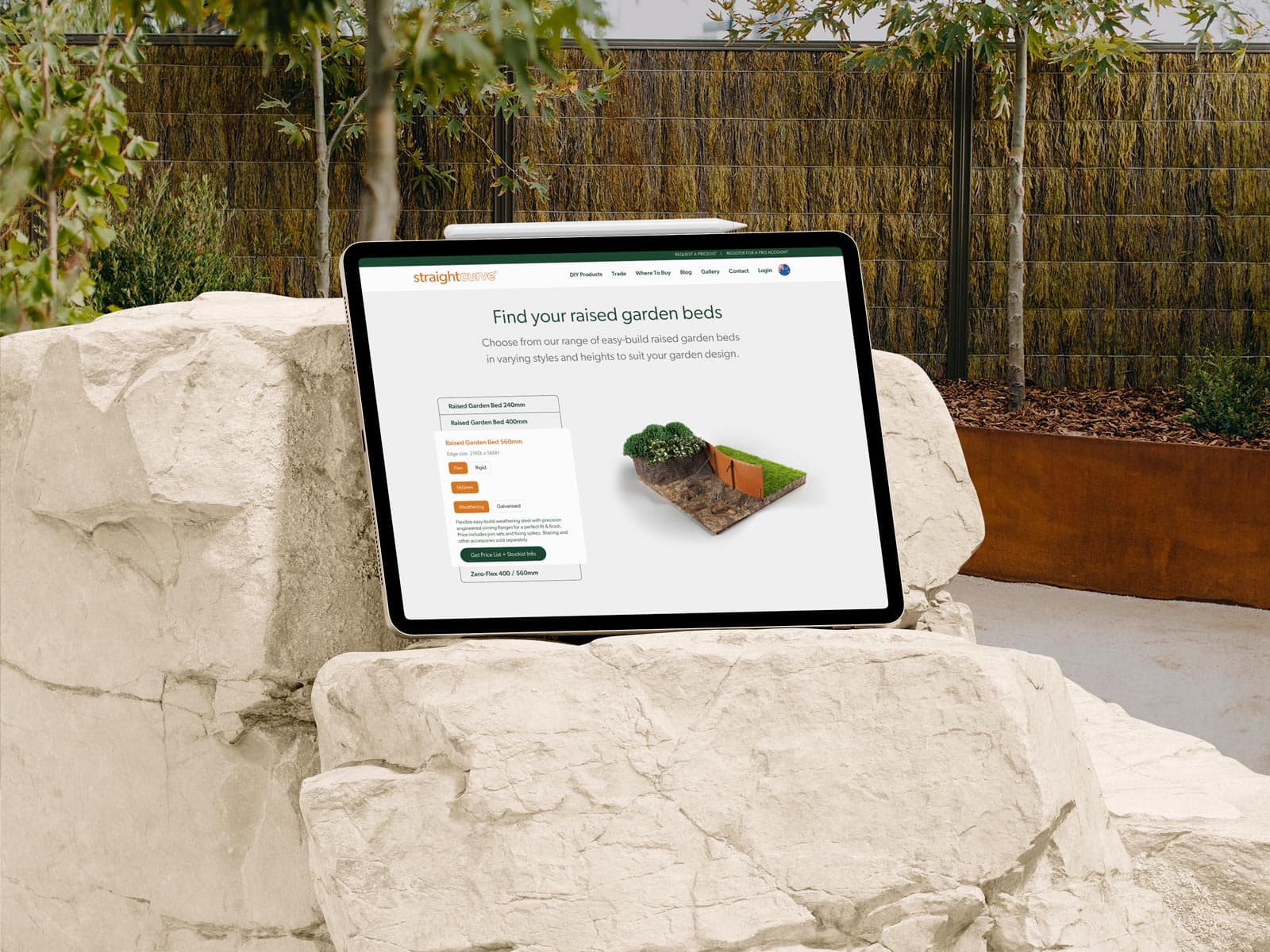 Straightcurve Website on iPad in a garden sitting on rocks