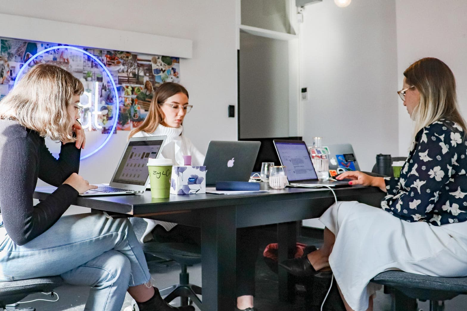 A small startup marketing team working on a digital marketing strategy